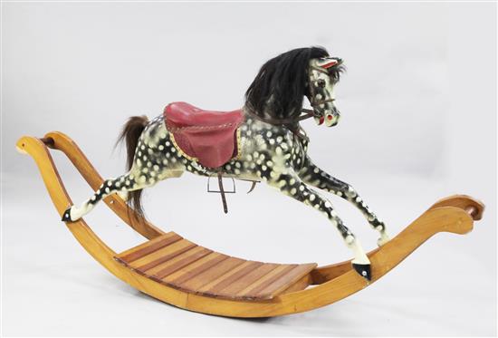 A black and grey painted rocking horse, overall length 6ft 11in.